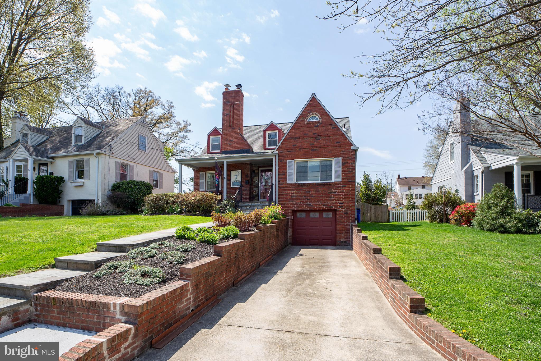 311 Timberwood Avenue Silver Spring, MD 20901 - Photo 3 of 44 a front view of a house with garden