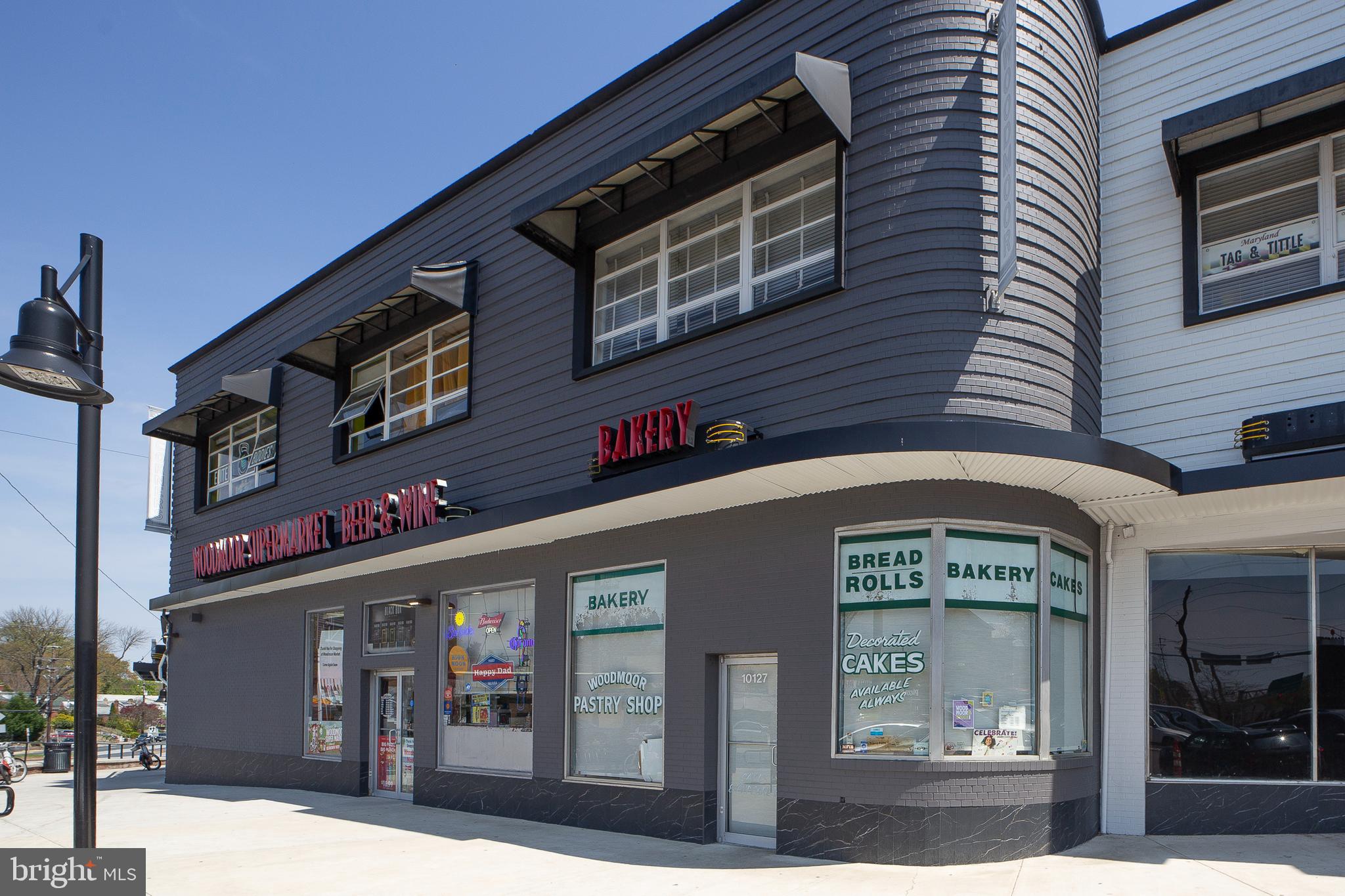 311 Timberwood Avenue Silver Spring, MD 20901 - Photo 40 of 44 a front view of multi story building with retail shops