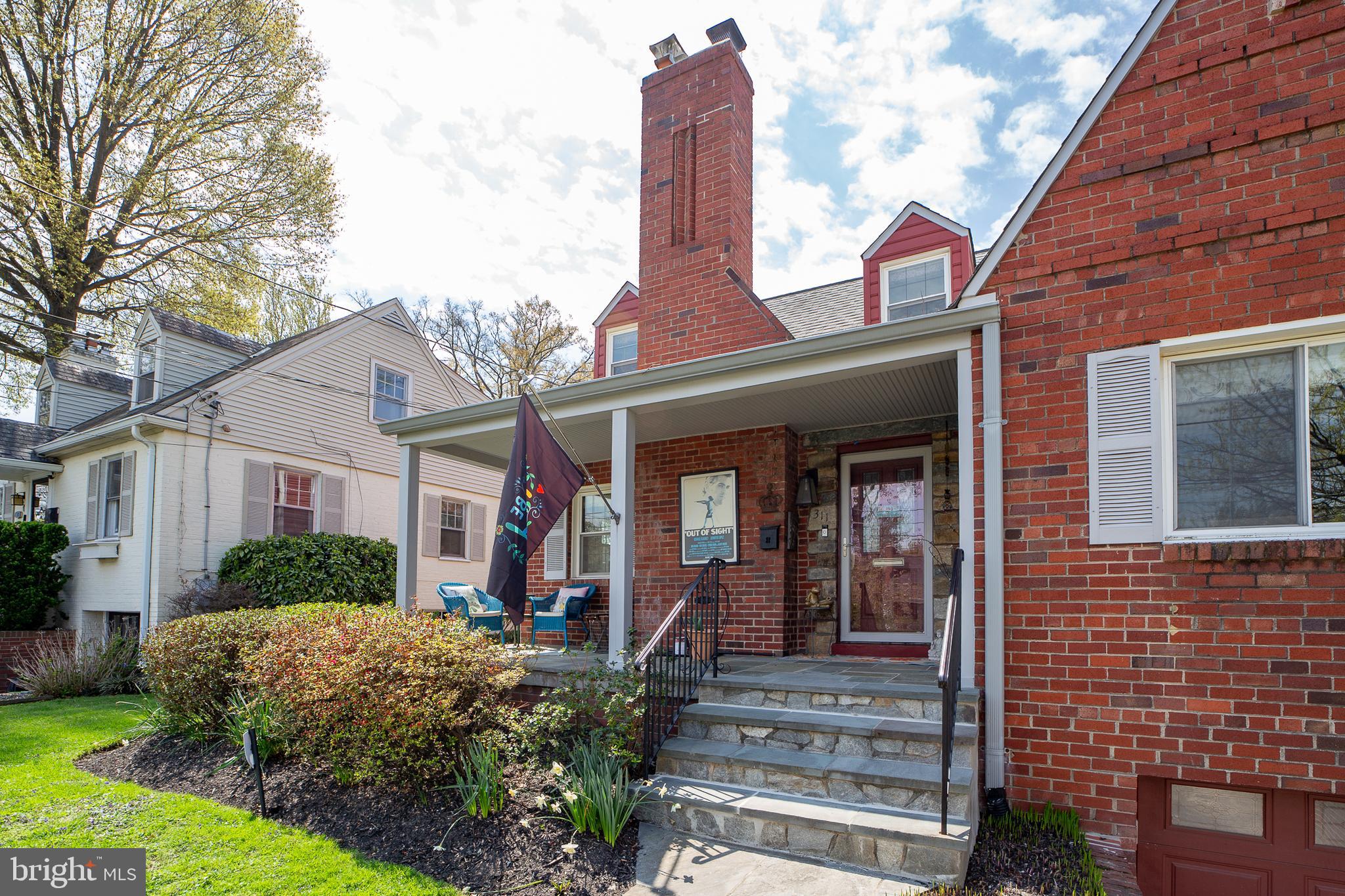 311 Timberwood Avenue Silver Spring, MD 20901 - Photo 4 of 44 a front view of a house with garden