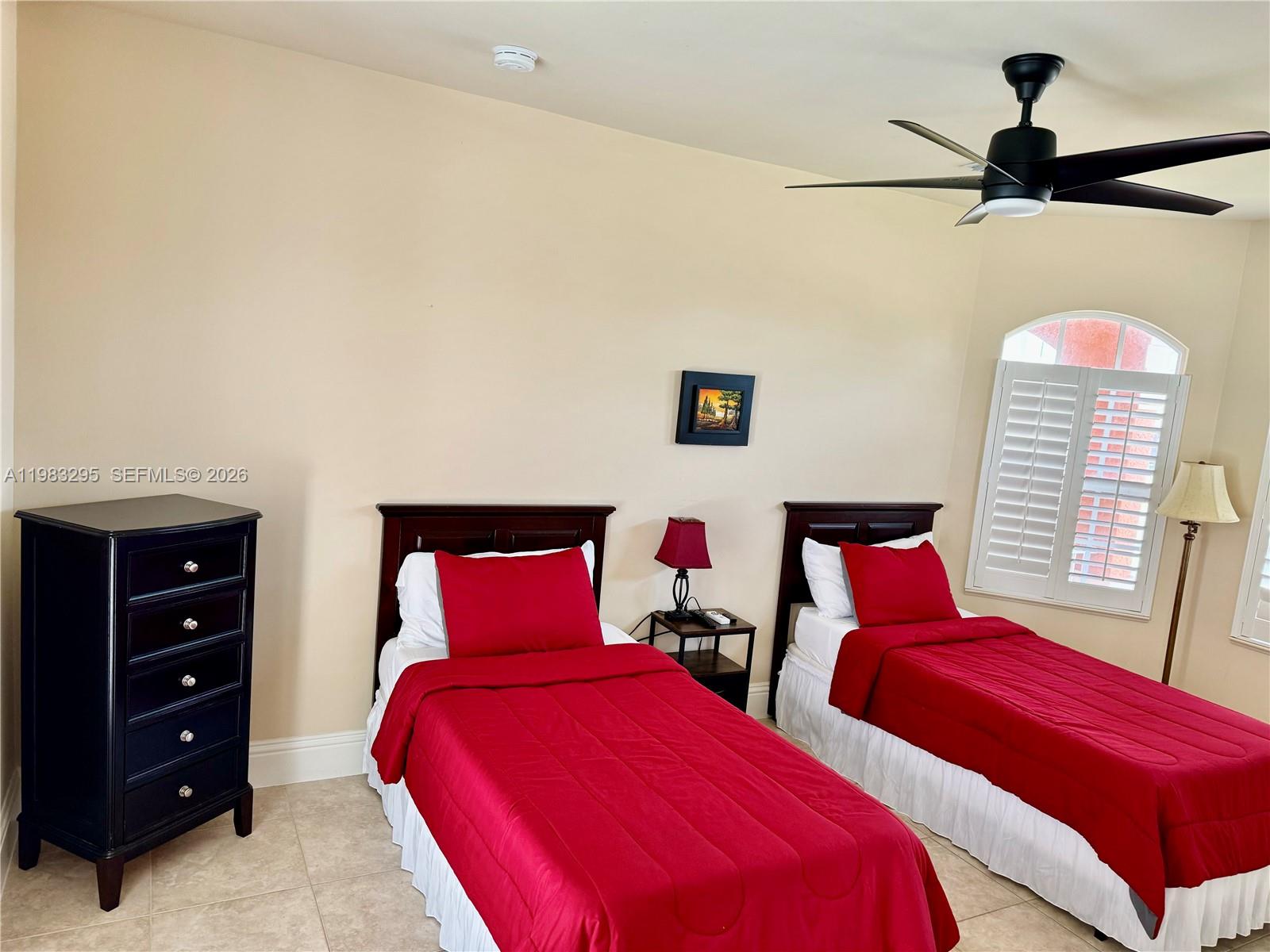 1740 Ludlow Road, Unit 1740 Marco Island, FL 34145 - Photo 12 of 58 a bedroom with two beds and a window