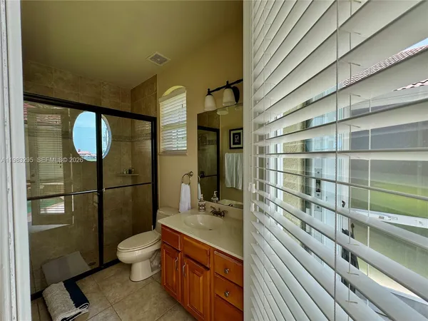 a view of a hallway with dining area and glass door