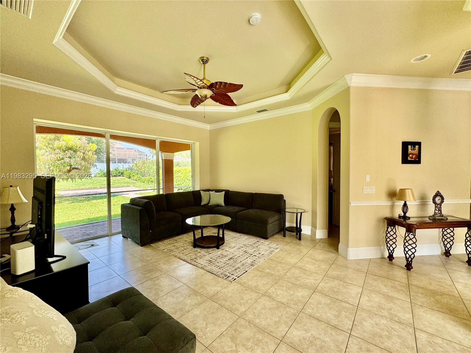 1740 Ludlow Road, Unit 1740 Marco Island, FL 34145 - Photo 32 of 58 a living room with furniture and a large window