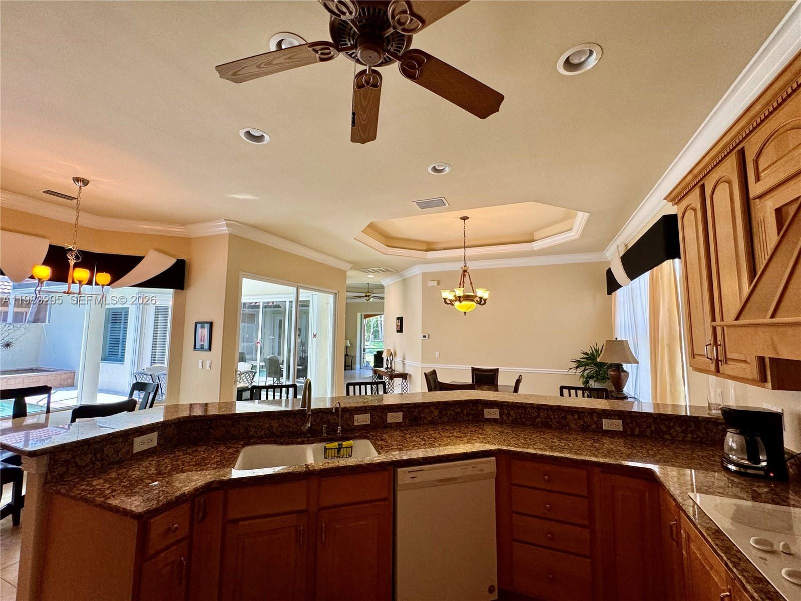 1740 Ludlow Road, Unit 1740 Marco Island, FL 34145 - Photo 33 of 58 a kitchen with a sink and chandelier