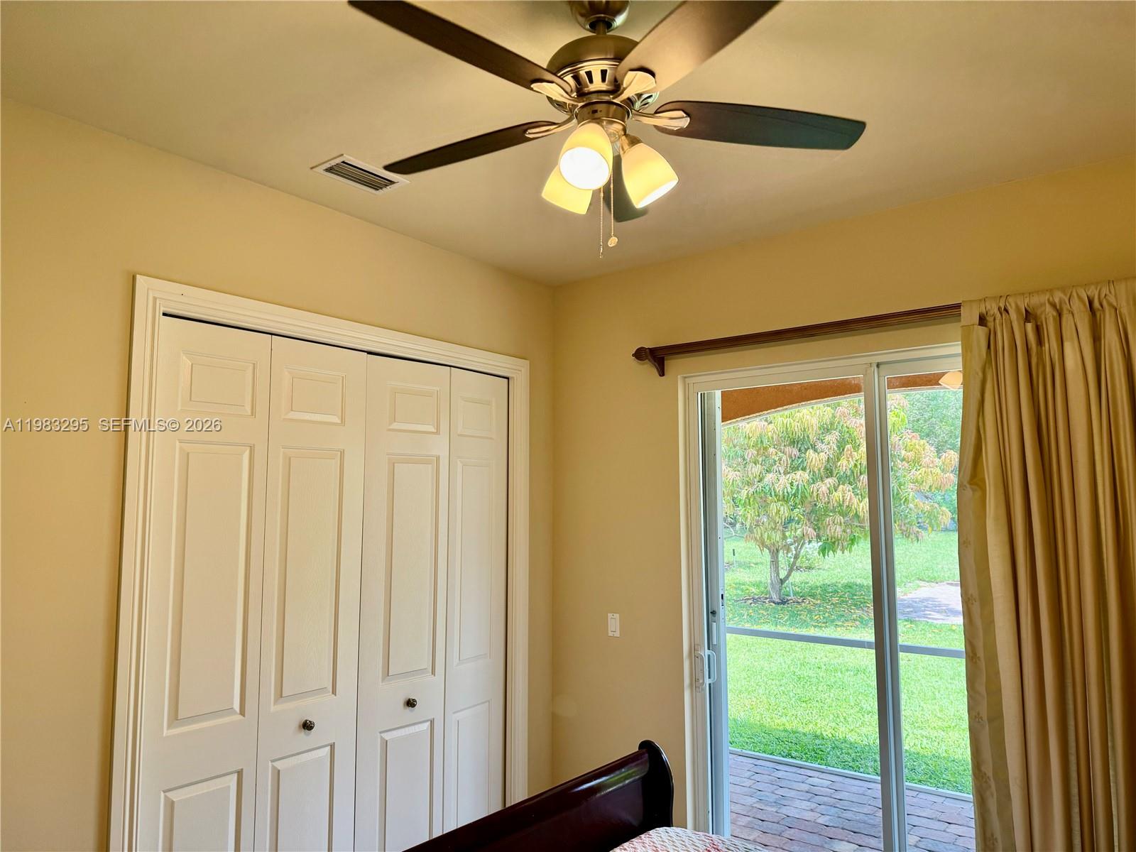 1740 Ludlow Road, Unit 1740 Marco Island, FL 34145 - Photo 38 of 58 a view of a livingroom with a chandelier fan and a large window