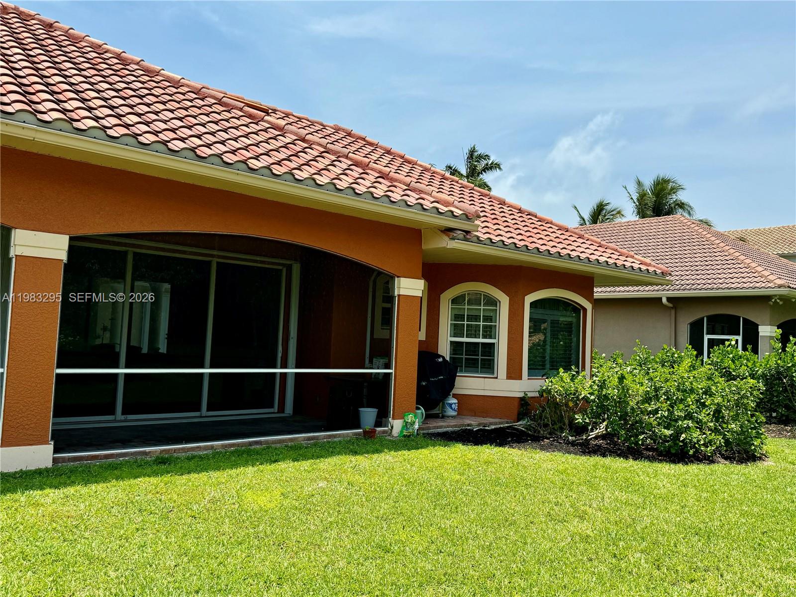 1740 Ludlow Road, Unit 1740 Marco Island, FL 34145 - Photo 53 of 58 a front view of a house with a yard