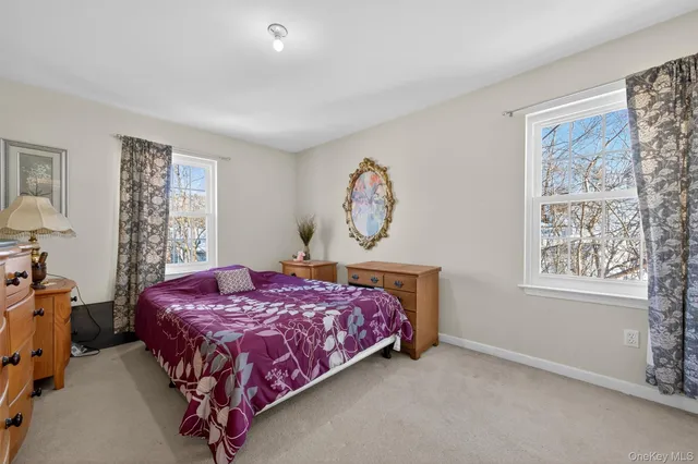 a bedroom with a bed and a cabinet