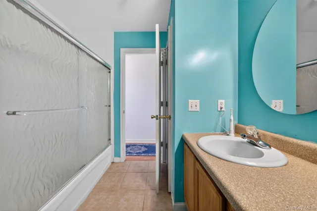 a work room with furniture and a flat screen tv