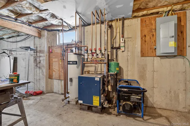 a utility room with dryer washer and stair