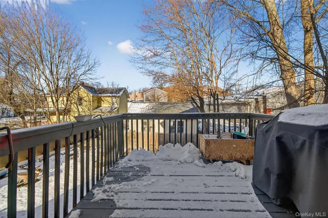a view of a patio with a table and chairs