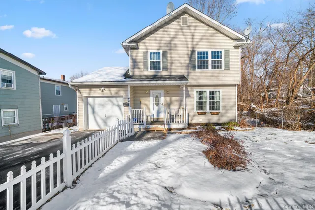 a view of a house with backyard porch and sitting area