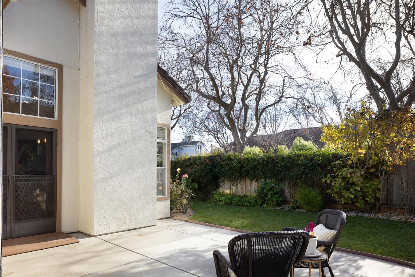 17776 Riverbend Road Salinas, CA 93908 - Photo 20 of 22 a backyard of a house with table and chairs plants and large tree