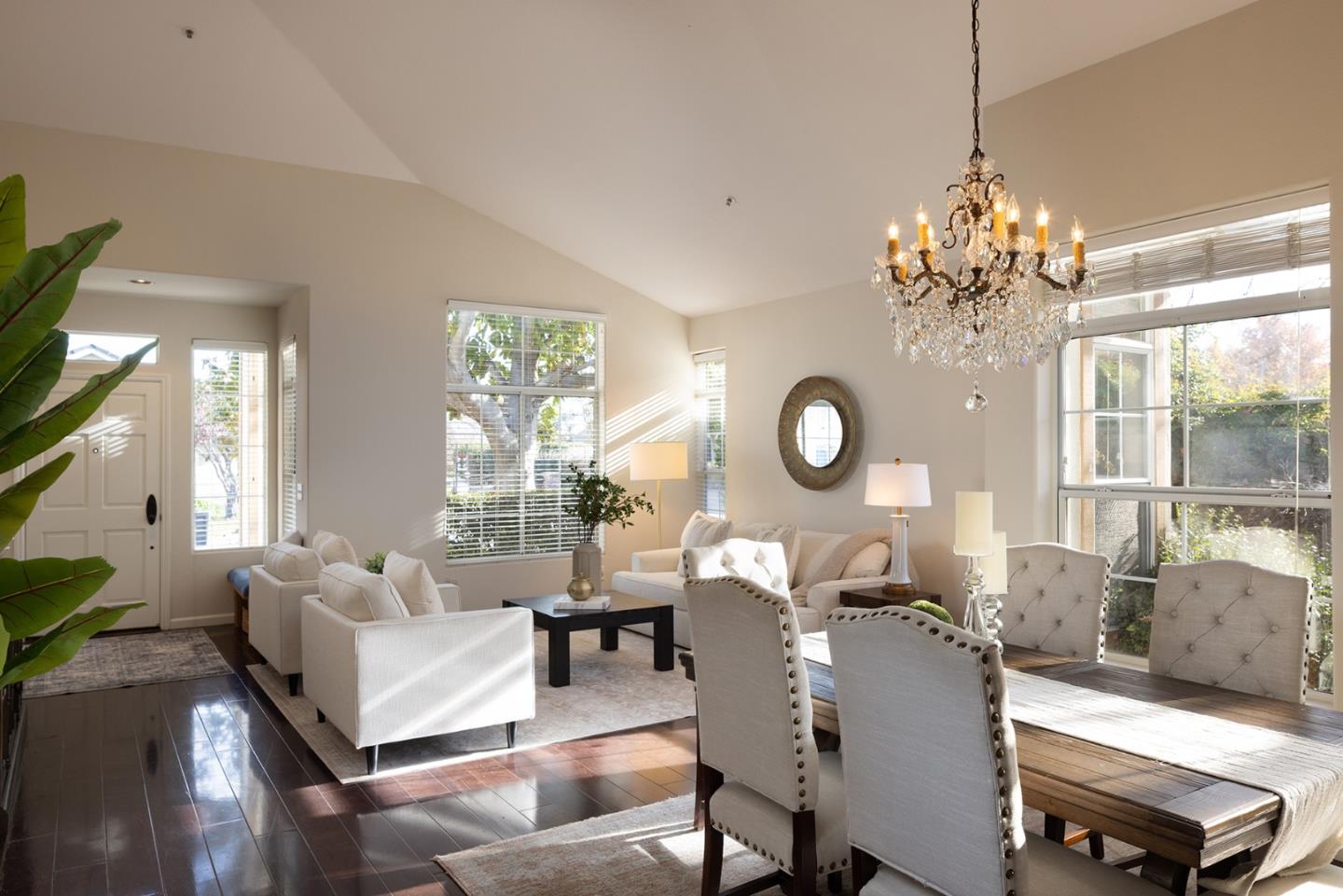 17776 Riverbend Road Salinas, CA 93908 - Photo 4 of 22 a living room with couches a chandelier and a large window
