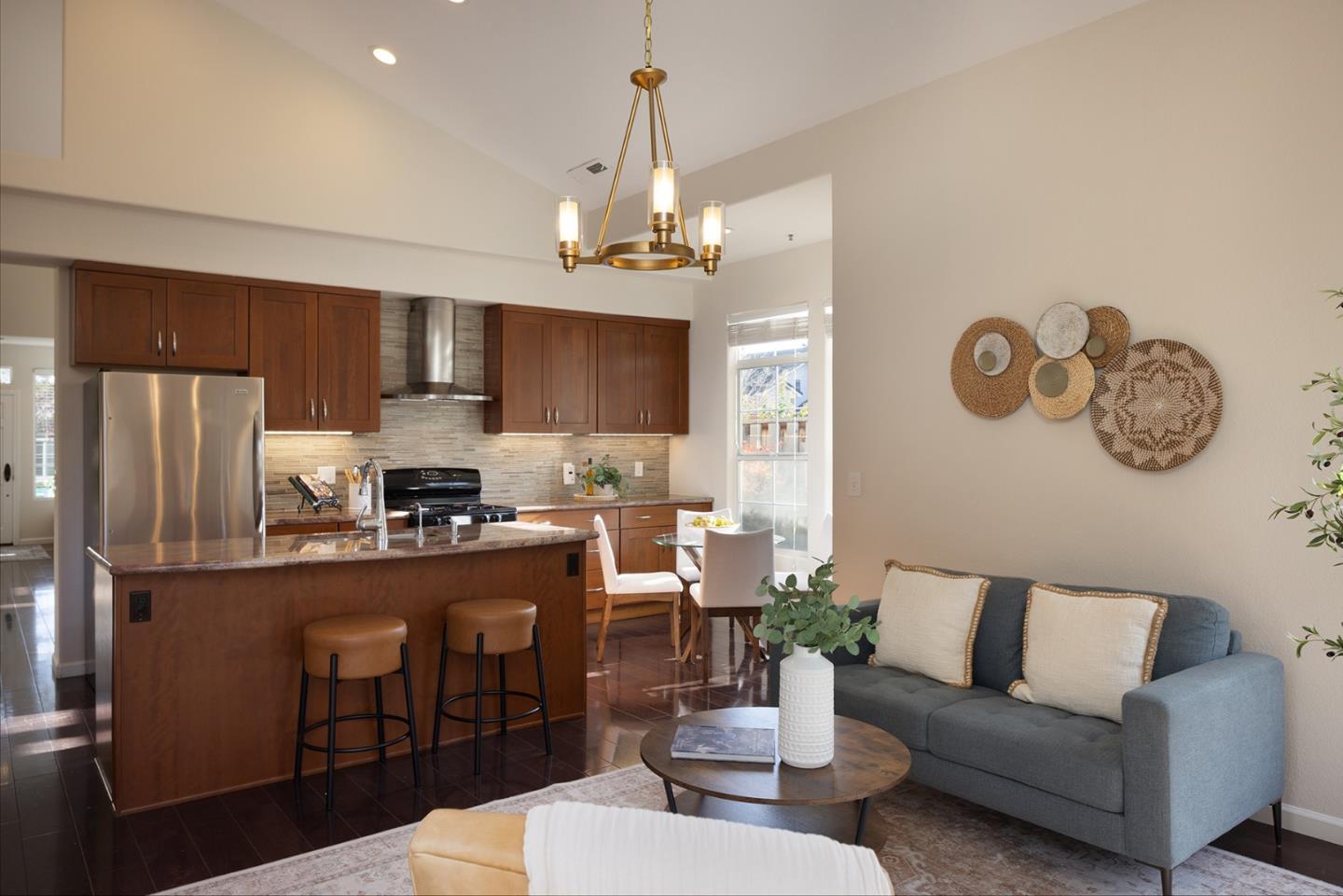 17776 Riverbend Road Salinas, CA 93908 - Photo 7 of 22 a living room with stainless steel appliances kitchen island a table and chairs