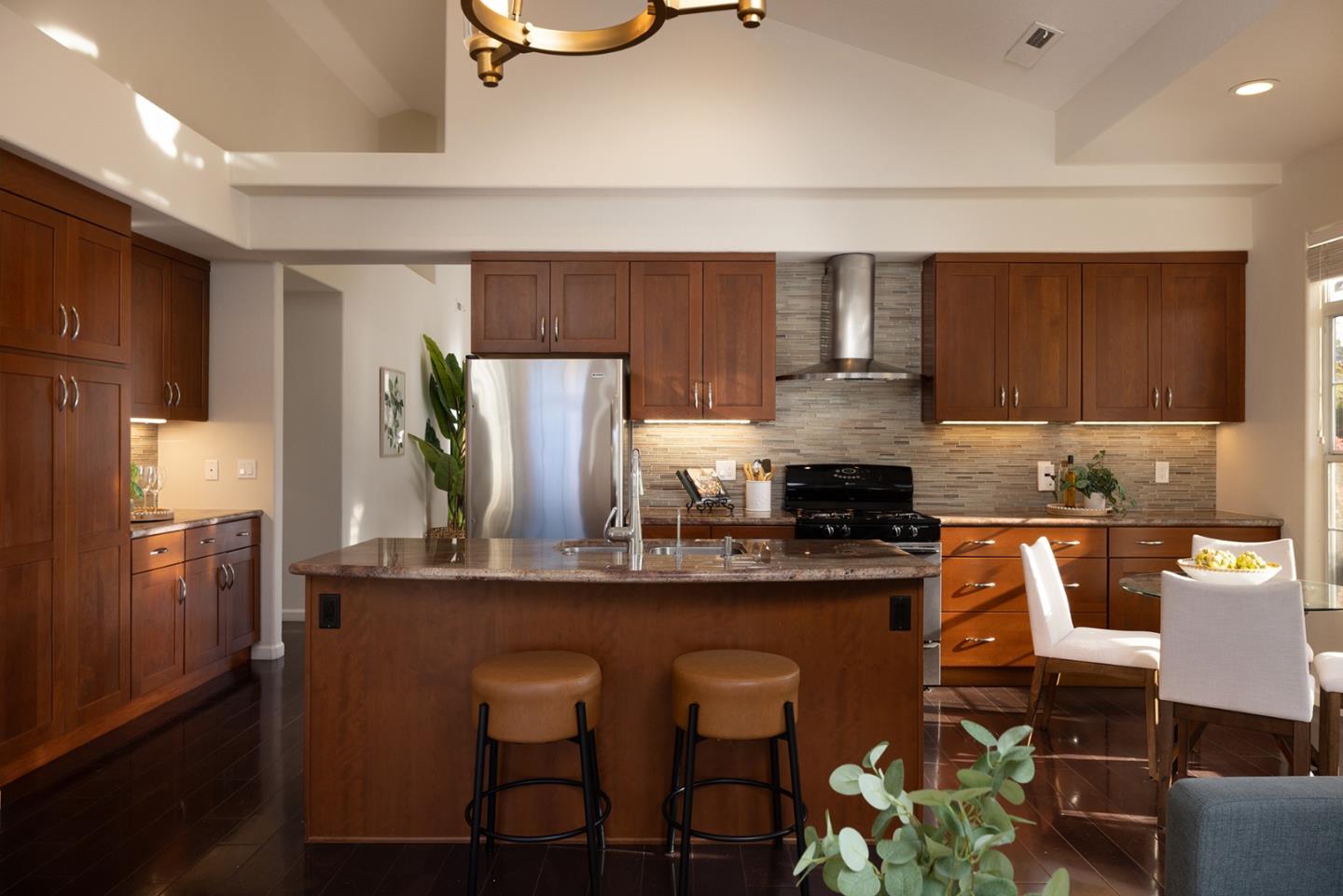 17776 Riverbend Road Salinas, CA 93908 - Photo 8 of 22 a kitchen with stainless steel appliances granite countertop a stove top oven a counter space and cabinets