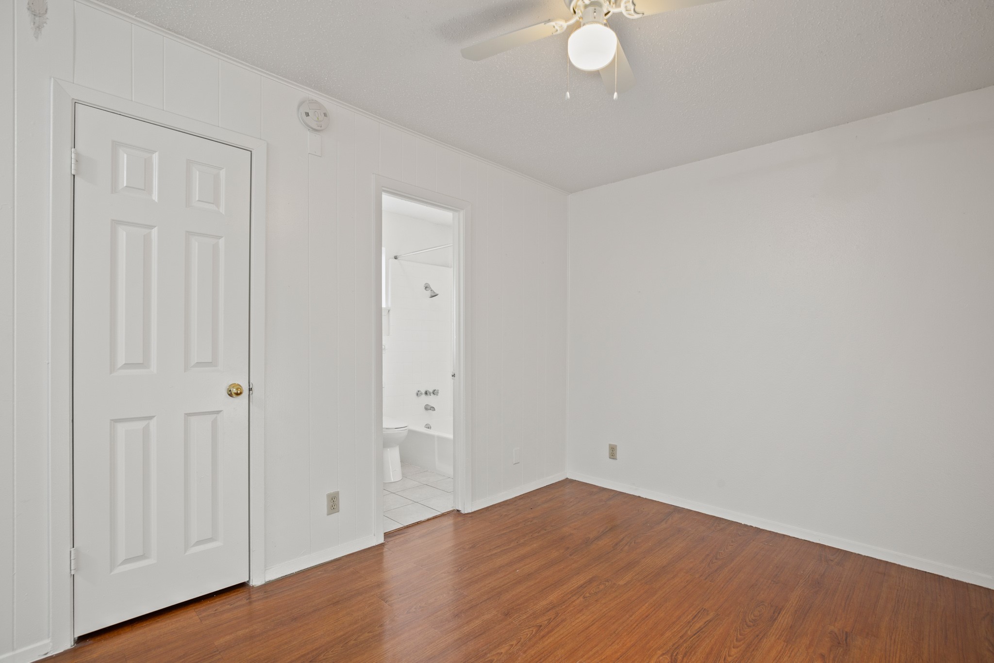 5300 Guadalupe Street, Unit 108 Austin, TX 78751 - Photo 9 of 11 a view of an empty room with wooden floor