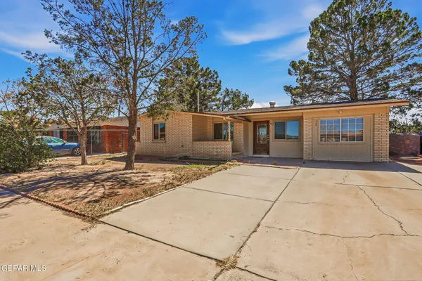 a house with trees in front of it