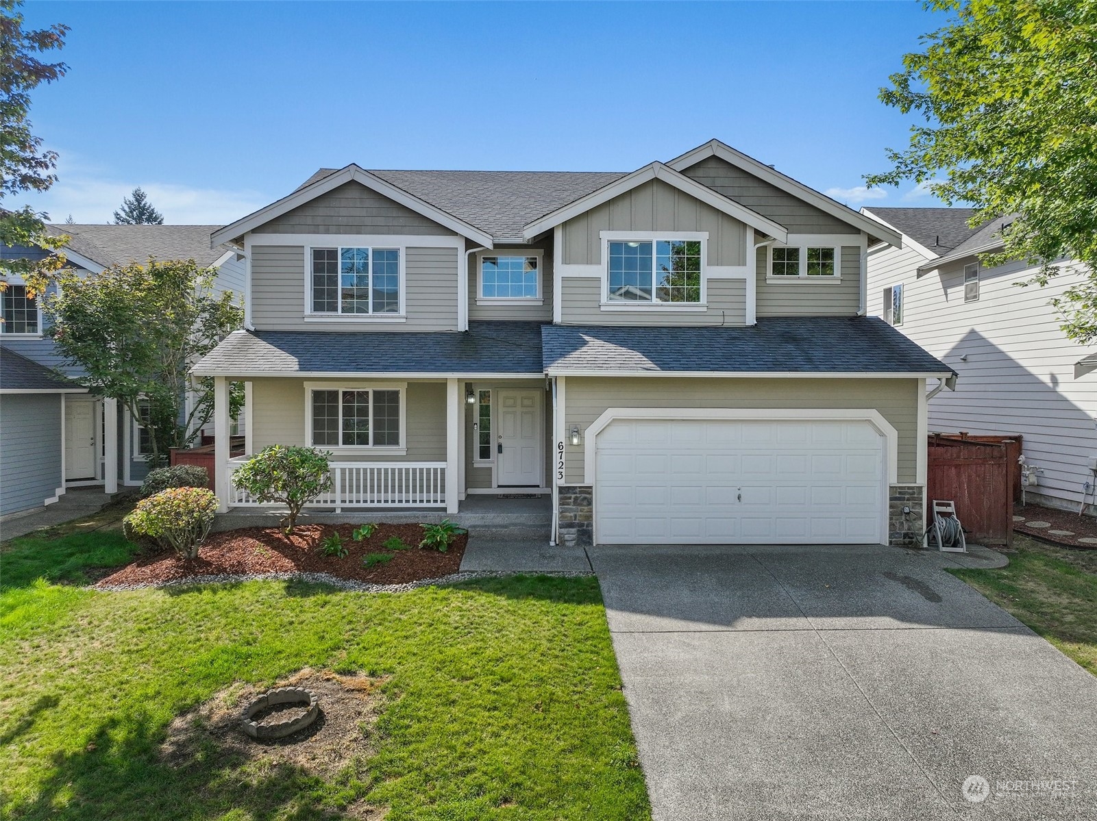 6723 Southeast 4th Street Renton, WA 98059 - Photo 1 of 38 a front view of a house with garden