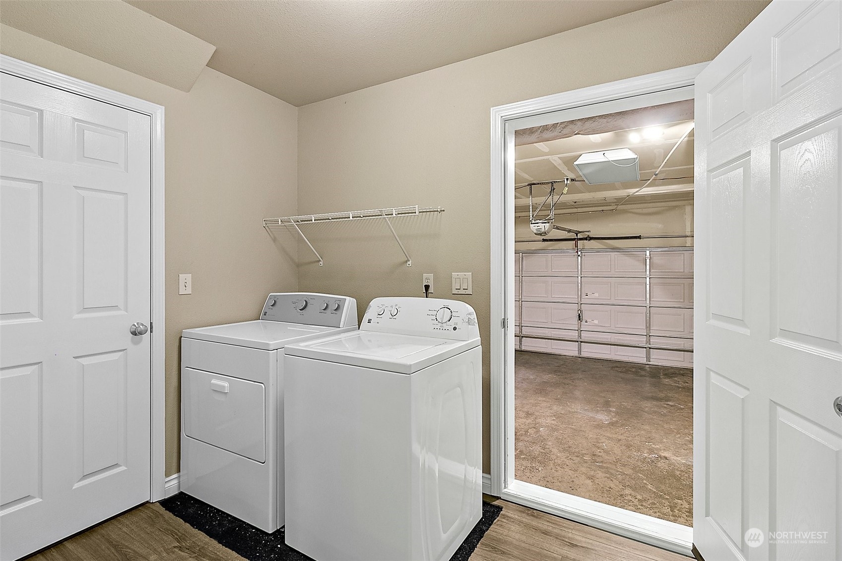 6723 Southeast 4th Street Renton, WA 98059 - Photo 16 of 38 a utility room with cabinets washer and dryer