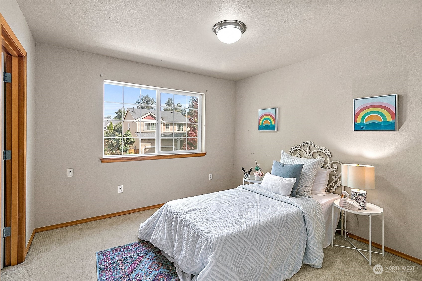 6723 Southeast 4th Street Renton, WA 98059 - Photo 18 of 38 a bedroom with a bed and a painting on the wall