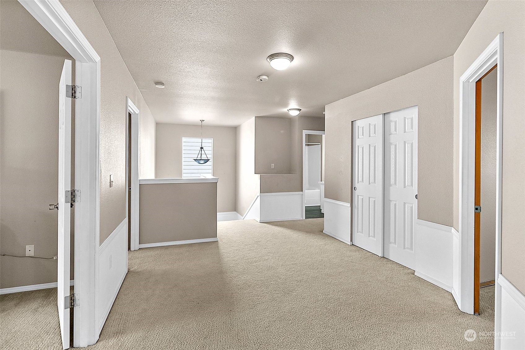 6723 Southeast 4th Street Renton, WA 98059 - Photo 19 of 38 a view of a big room with closet and windows