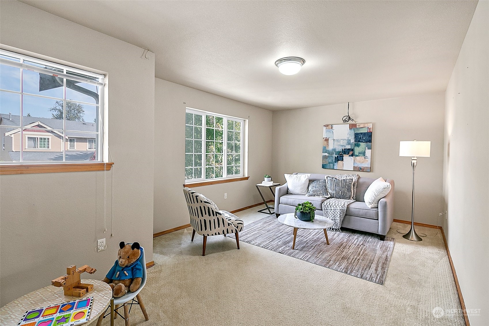 6723 Southeast 4th Street Renton, WA 98059 - Photo 20 of 38 a living room with furniture and a potted plant