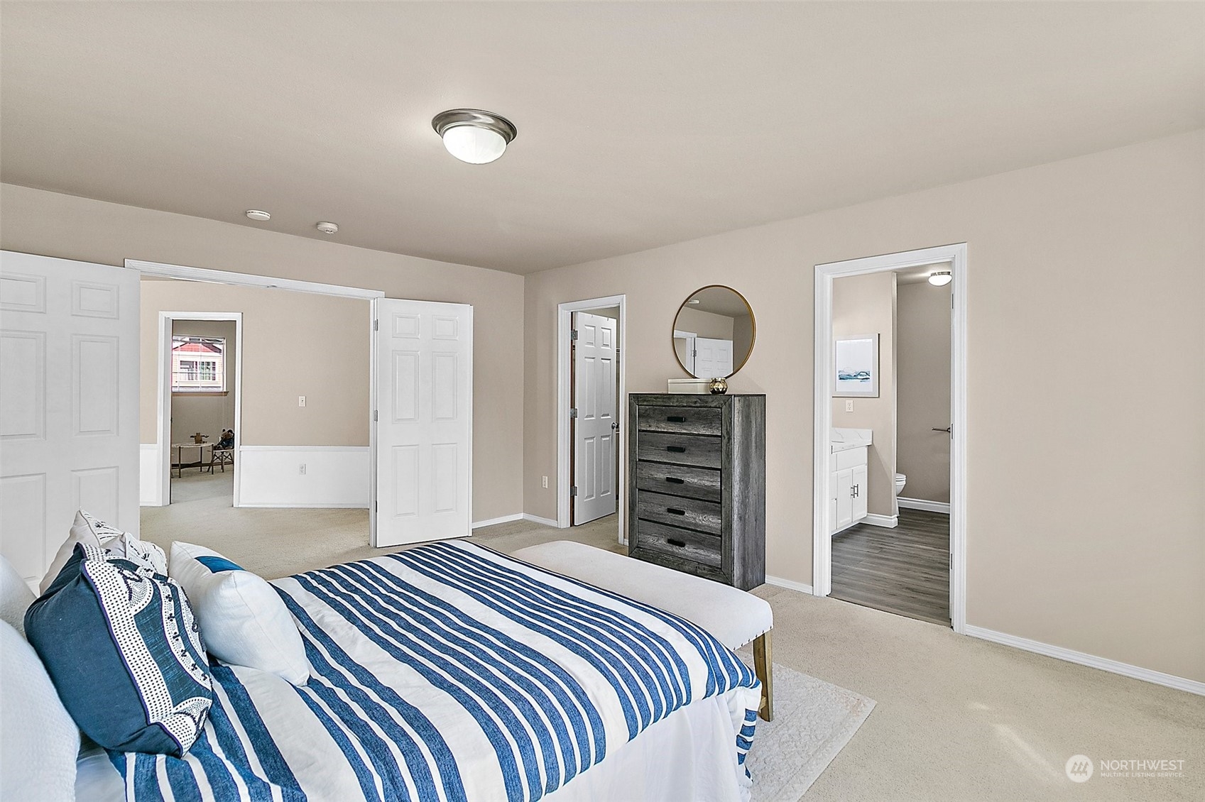 6723 Southeast 4th Street Renton, WA 98059 - Photo 25 of 38 a bedroom with a bed and a chandelier