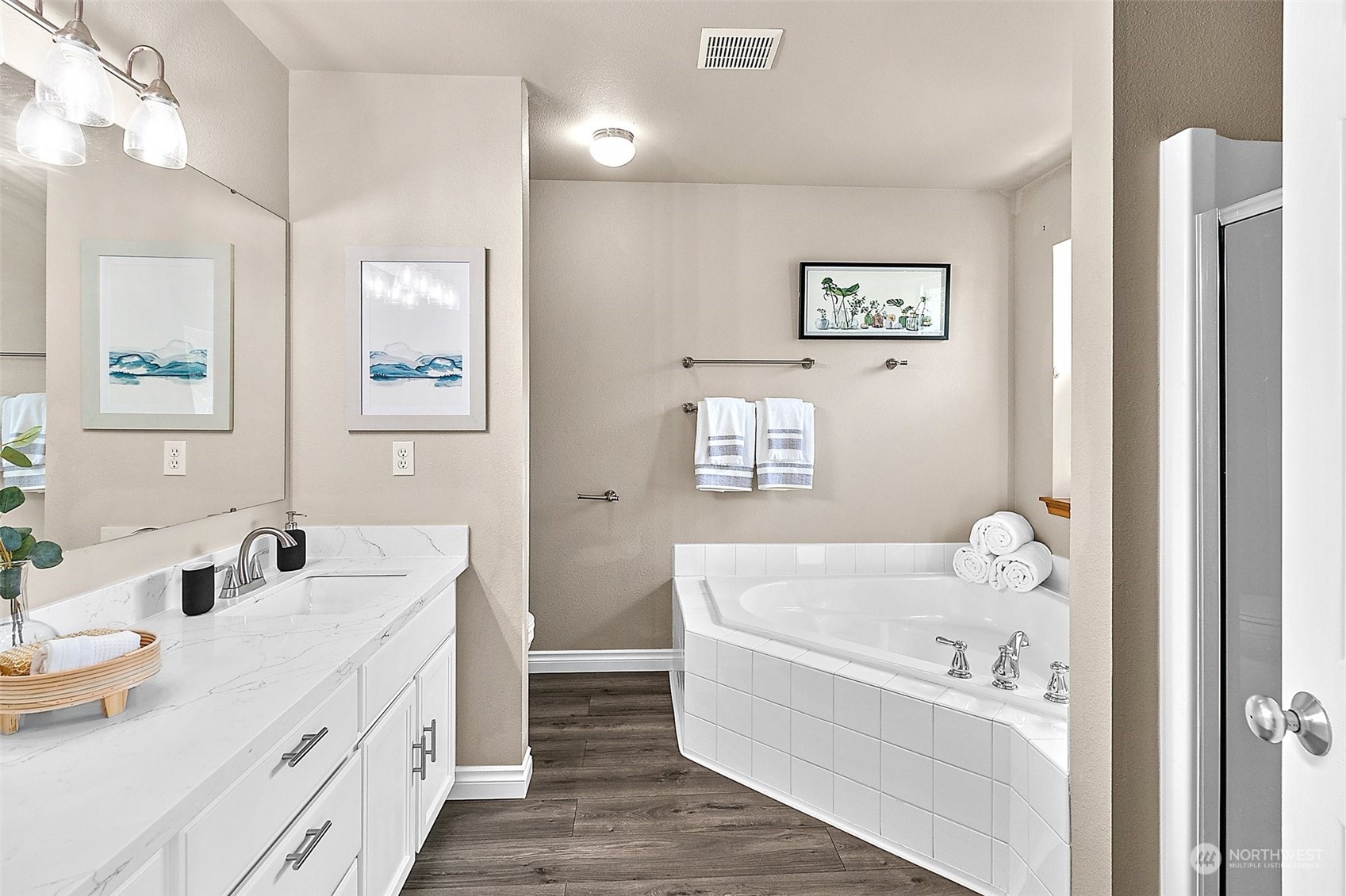 6723 Southeast 4th Street Renton, WA 98059 - Photo 29 of 38 a bathroom with a tub sink and mirror