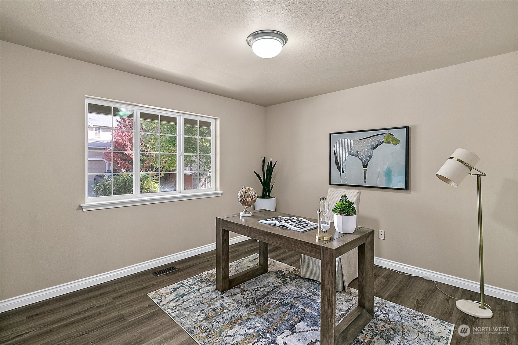 6723 Southeast 4th Street Renton, WA 98059 - Photo 4 of 38 a work room with furniture and wooden floor