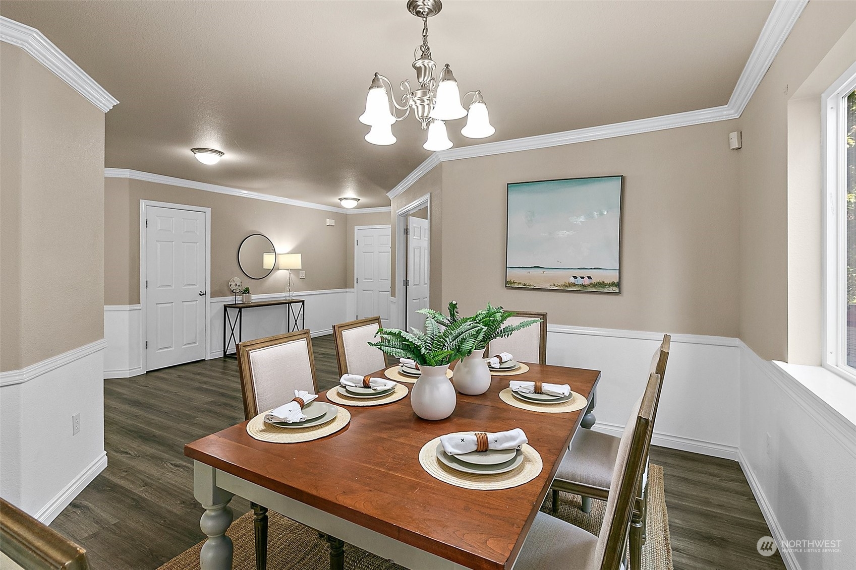 6723 Southeast 4th Street Renton, WA 98059 - Photo 6 of 38 a view of a dining room with furniture a chandelier and wooden floor