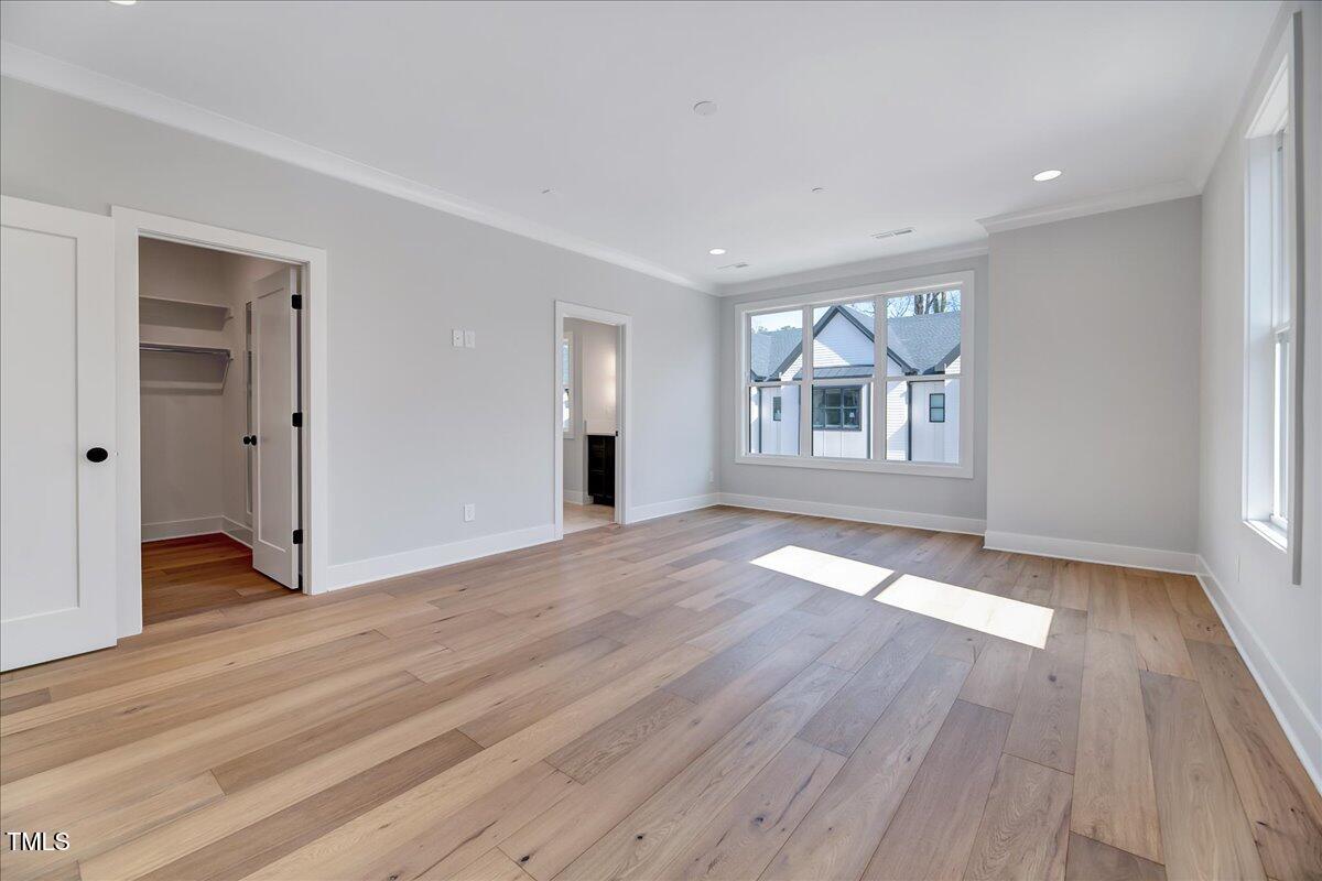 811 Maple Berry Lane, Unit 106 Raleigh, NC 27607 - Photo 11 of 30 a view of livingroom with hardwood floor and window