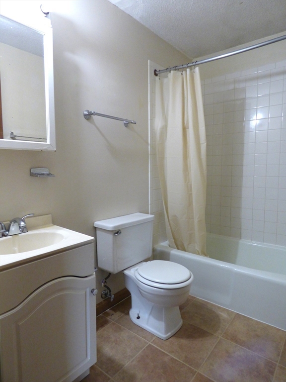 16-18 Daniel Street Springfield, MA 01151 - Photo 7 of 14 a bathroom with a sink toilet and shower