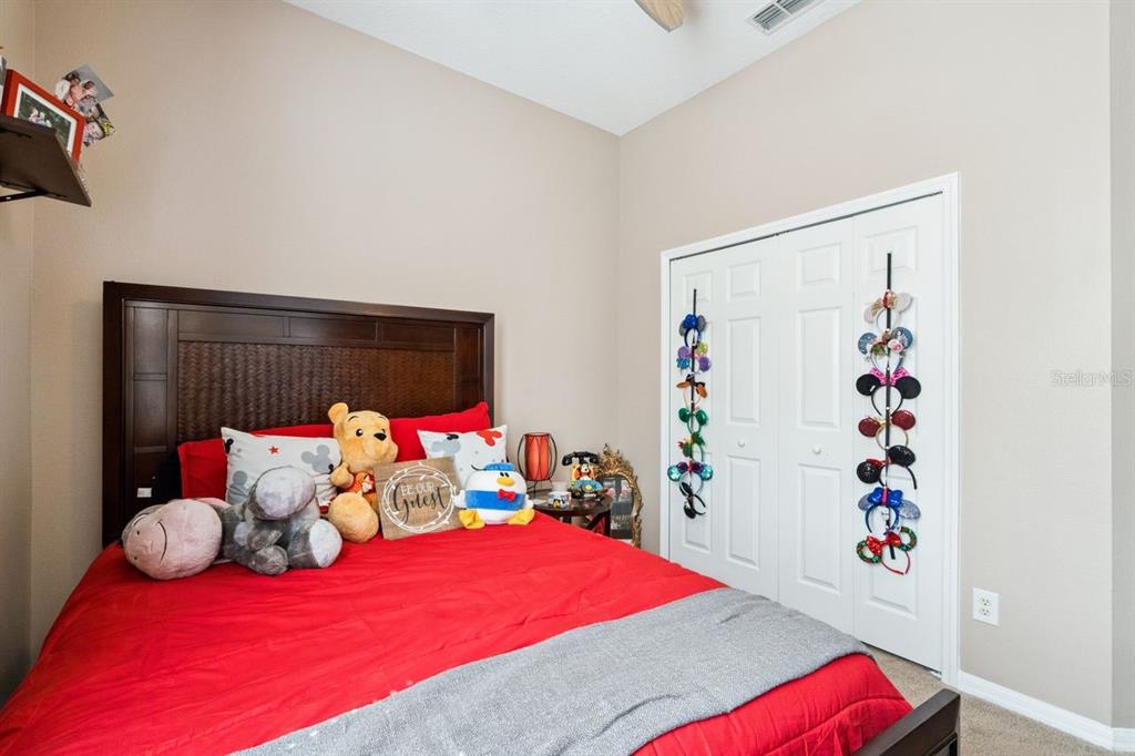 8484 Dover View Lane Orlando, FL 32829 - Photo 16 of 41 a bedroom with furniture and a bed