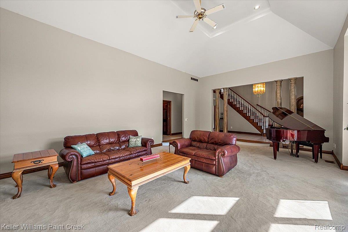 69069 Campground Road Romeo, MI 48065 - Photo 25 of 78 Spacious living area featuring a vaulted ceiling with a ceiling fan, recessed lighting, and soft neutral wall tones