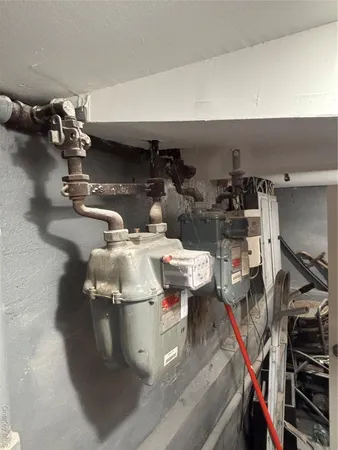 a close view of water heater room with gym equipment