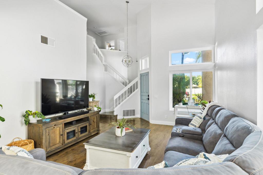 1896 Timber Trail Vista, CA 92081 - Photo 11 of 65 a living room with furniture and a flat screen tv
