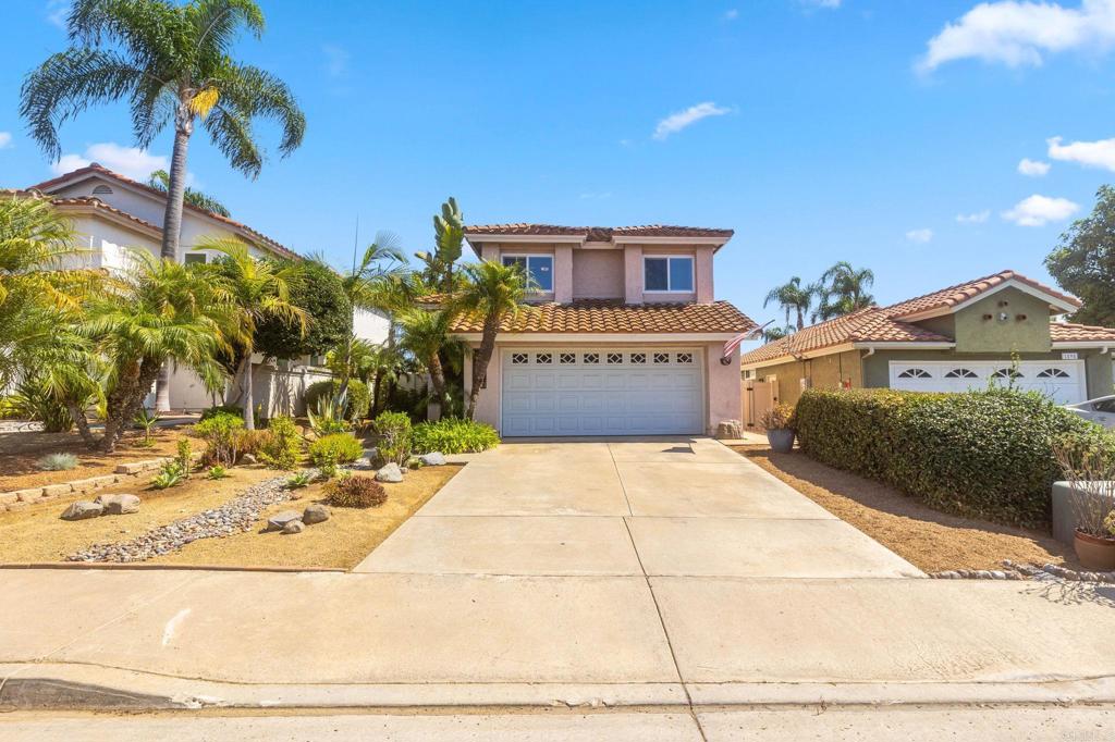 1896 Timber Trail Vista, CA 92081 - Photo 20 of 65 a front view of a house with a yard