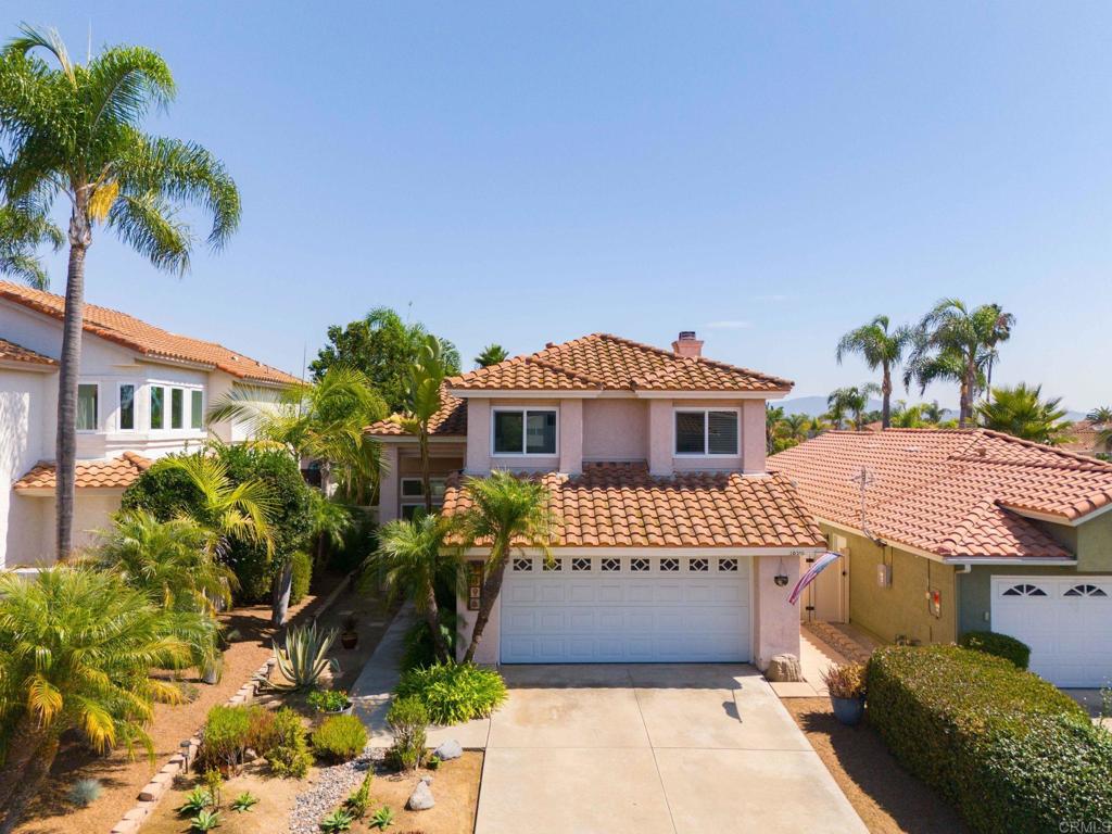 1896 Timber Trail Vista, CA 92081 - Photo 2 of 65 a front view of a house with a yard and potted plants