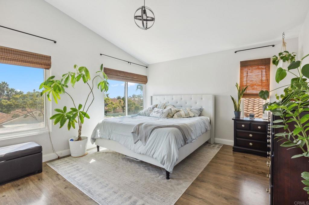 1896 Timber Trail Vista, CA 92081 - Photo 35 of 65 a bedroom with a bed and a potted plant