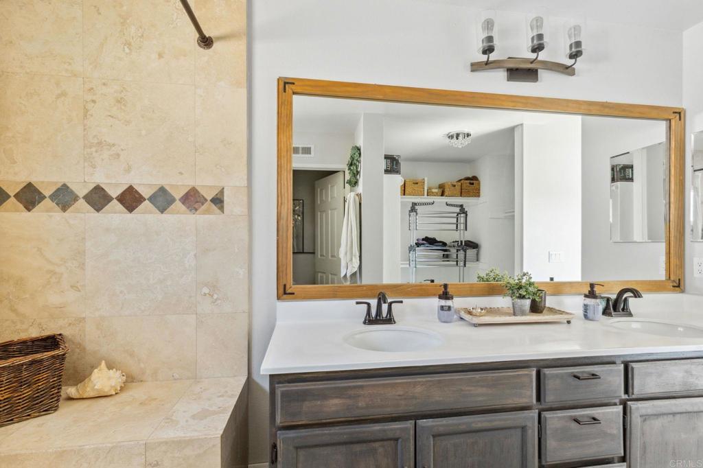 1896 Timber Trail Vista, CA 92081 - Photo 43 of 65 a bathroom with a sink and a mirror