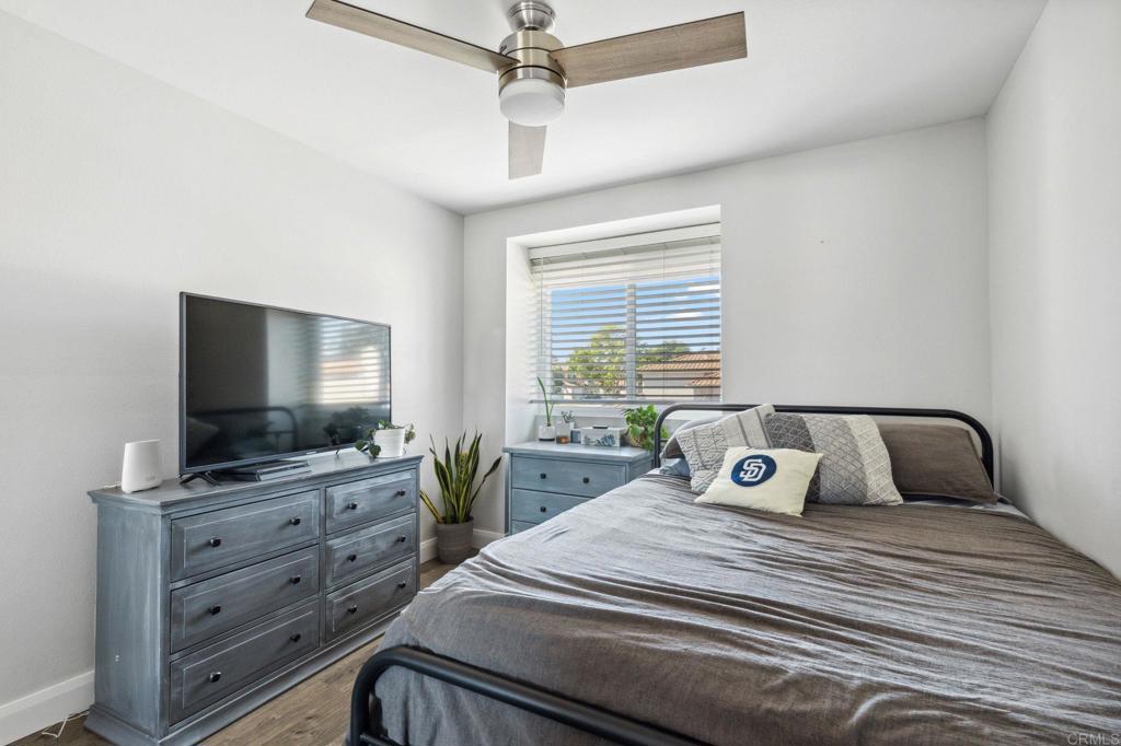 1896 Timber Trail Vista, CA 92081 - Photo 53 of 65 a bedroom with a bed and a flat screen tv