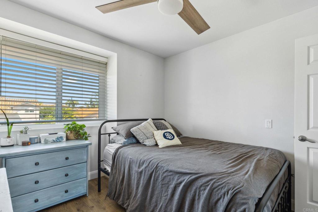 1896 Timber Trail Vista, CA 92081 - Photo 54 of 65 a bedroom with a bed and window