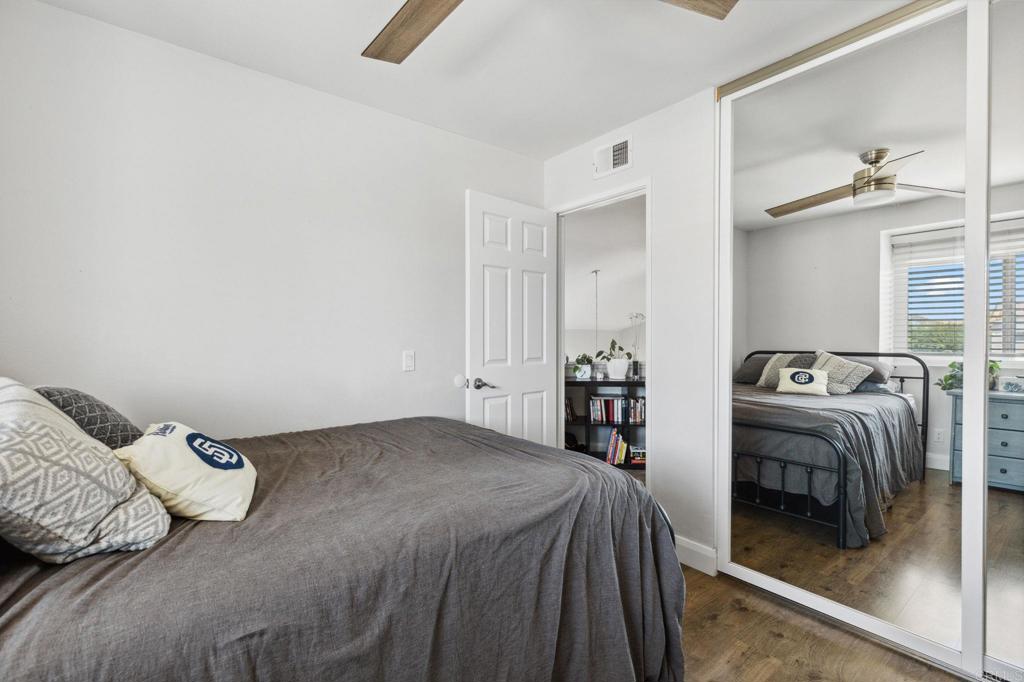 1896 Timber Trail Vista, CA 92081 - Photo 55 of 65 a bedroom with a bed and a mirror on dresser