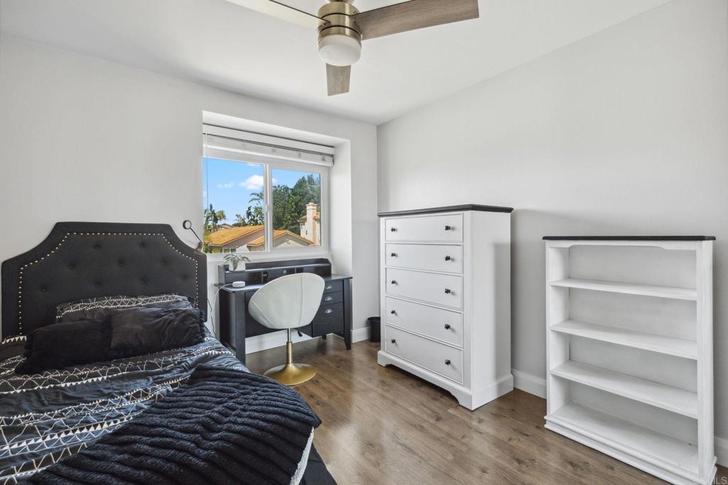 1896 Timber Trail Vista, CA 92081 - Photo 56 of 65 a bedroom with a bed and a dresser