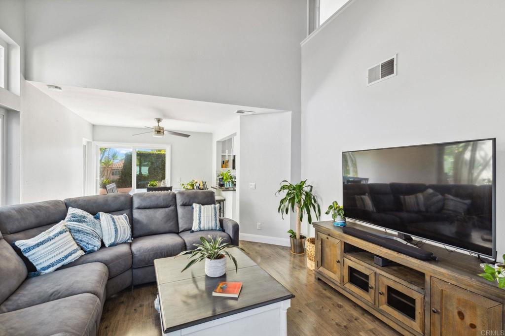 1896 Timber Trail Vista, CA 92081 - Photo 6 of 65 a living room with furniture and a flat screen tv
