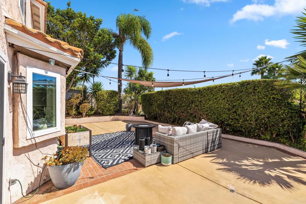 1896 Timber Trail Vista, CA 92081 - Photo 65 of 65 a view of a patio with couches table and chairs and potted plants