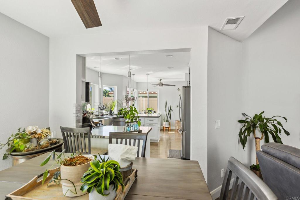 1896 Timber Trail Vista, CA 92081 - Photo 7 of 65 a view of a dining room with furniture window and wooden floor