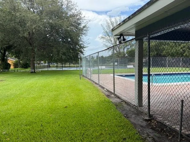 a view of a backyard with a small cabin