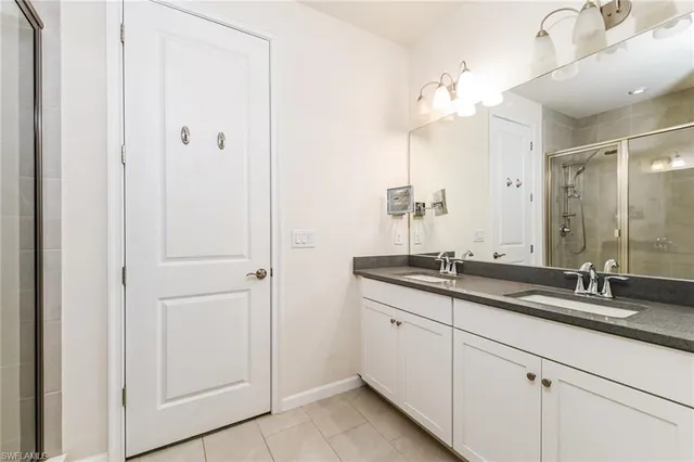 a bathroom with a granite countertop sink mirror and a