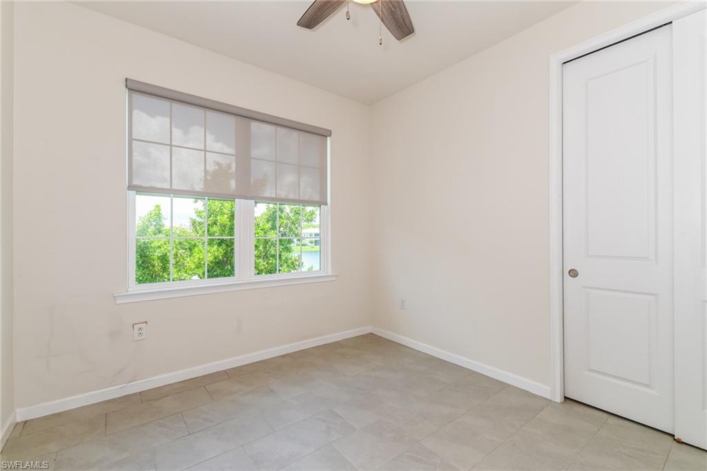 4721 Arboretum Circle, Unit 201 Naples, FL 34112 - Photo 12 of 26 an empty room with a window
