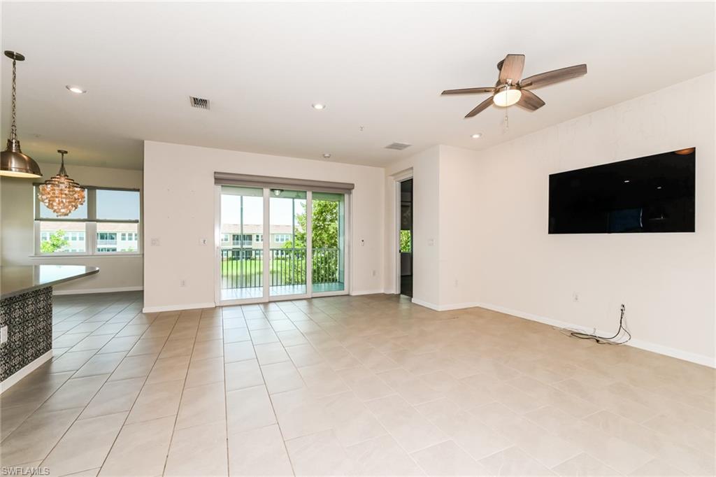 4721 Arboretum Circle, Unit 201 Naples, FL 34112 - Photo 2 of 26 a view of a livingroom with a flat screen tv